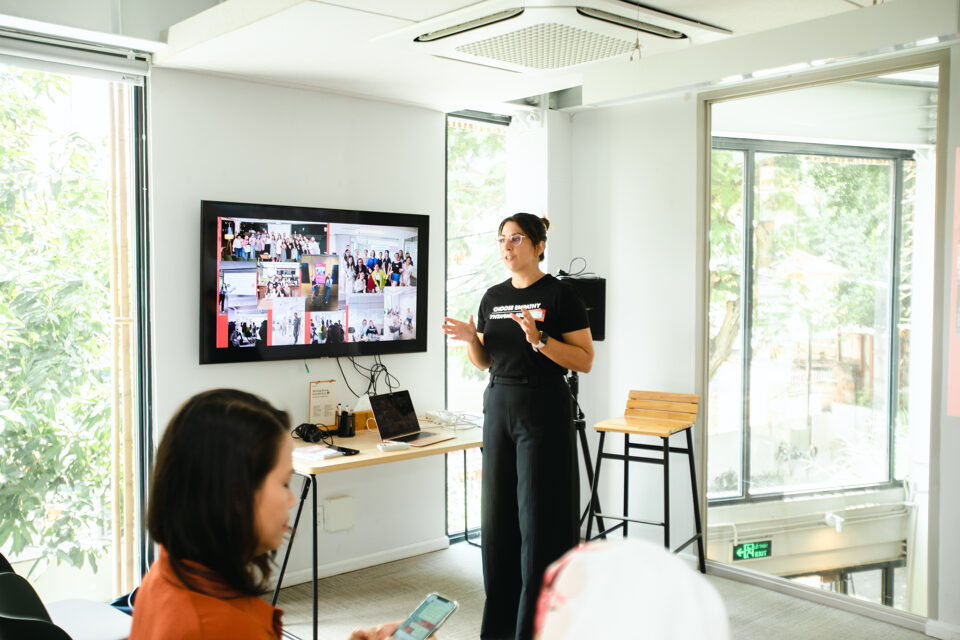 Kalina presenting to a group at a tech workshop